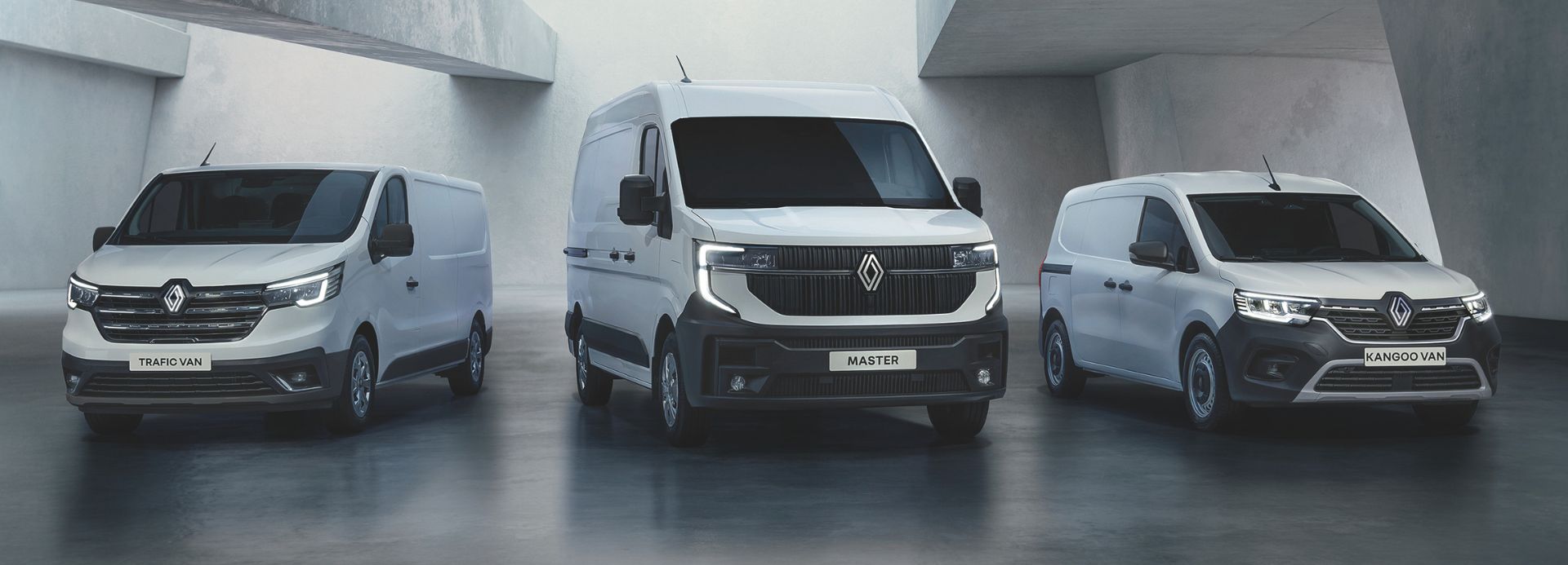 Drei weiße Renault Transporter Modelle